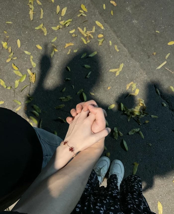 cute pair holding hands