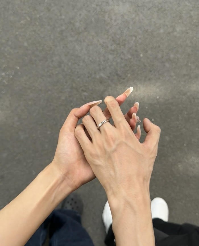 joined hands of couple