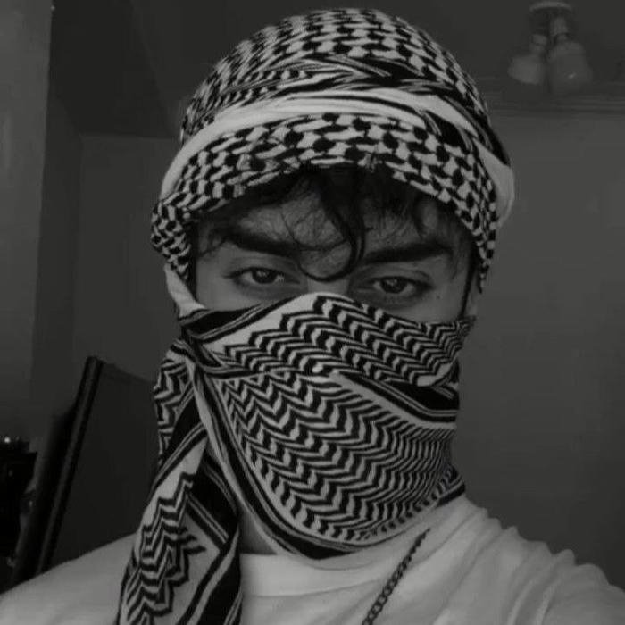 Black and white photo man covering face with scarf