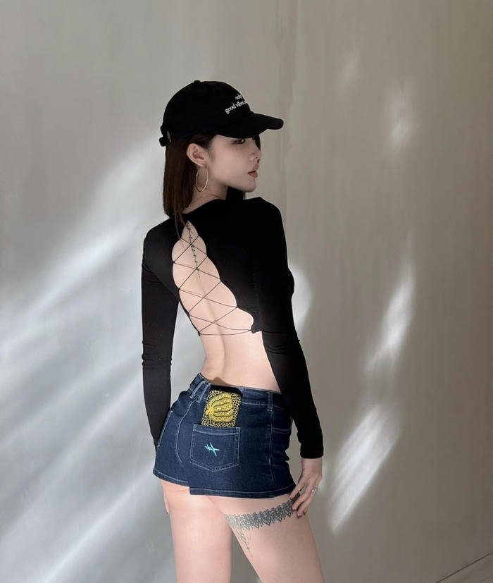 Cap girl dp under city night lights