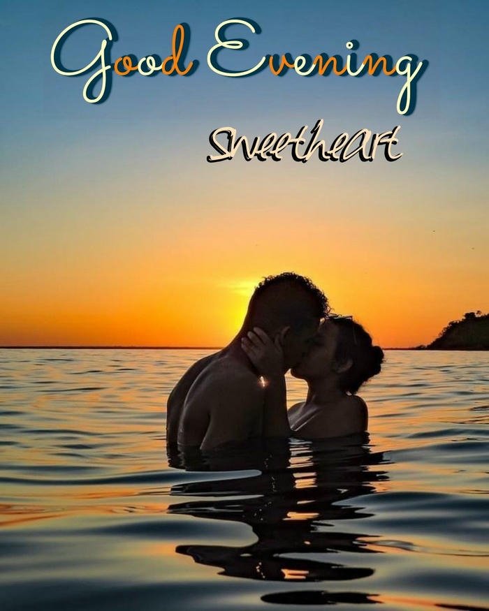 Good evening love image couple hugging in water sunset silhouette
