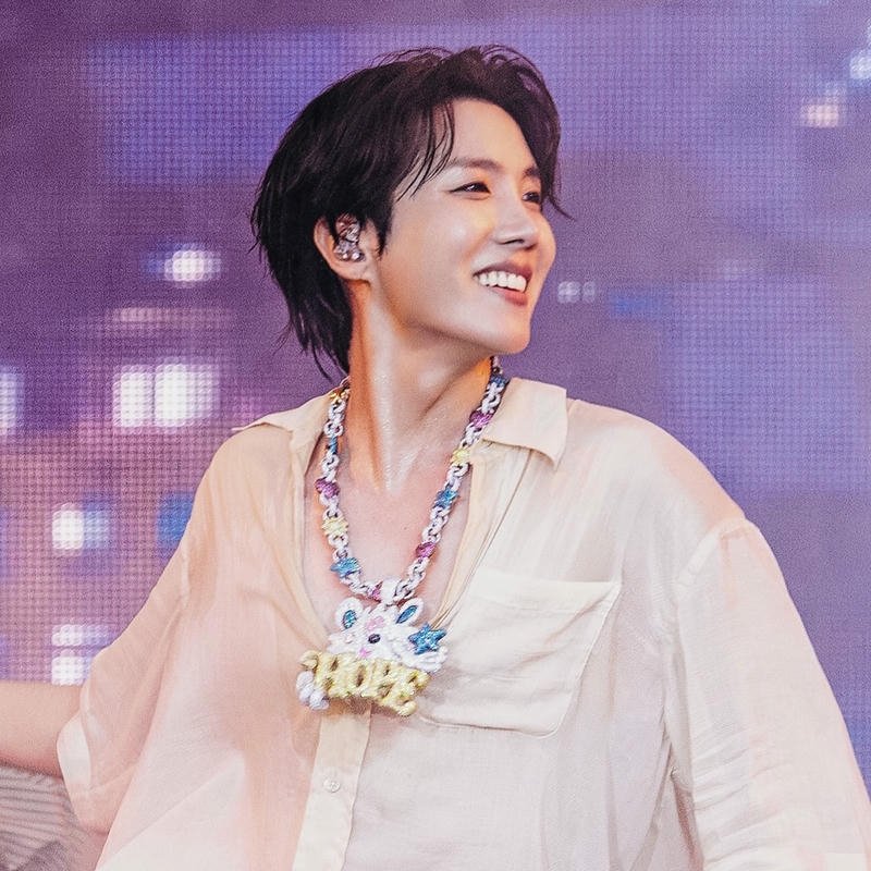 J-Hope pink shirt smiling bright stage performance view art