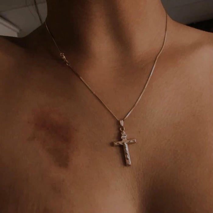 Love bites images woman cross necklace chest red marks