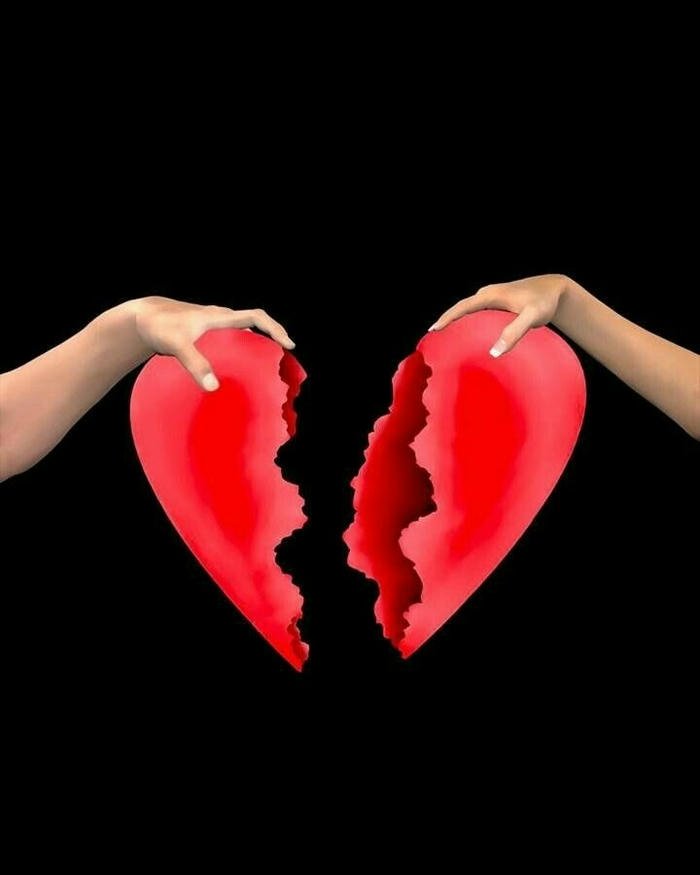 Love failure images hands holding two pieces red broken heart