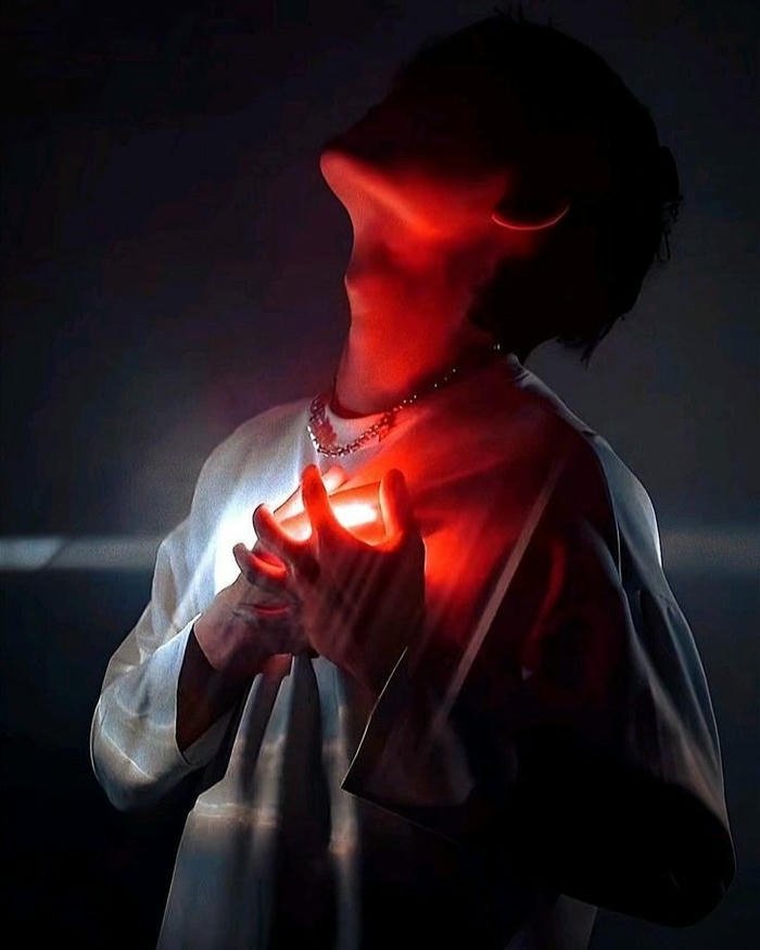 Love failure images person holding glowing broken heart dark