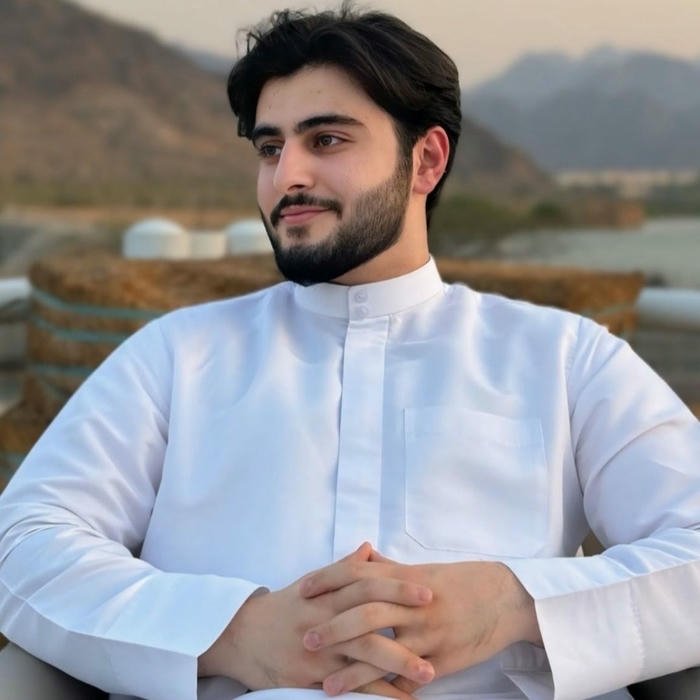 Muslim boys dp handsome man sitting by the lake