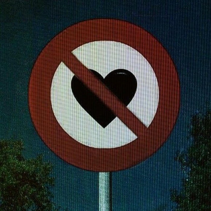 No love dp road sign banning love against blue sky