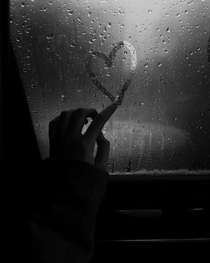 Sad love images lonely figure sitting on bench in dark park
