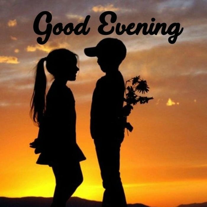 Silhouette couple holding flowers sunset yellow sky romantic view