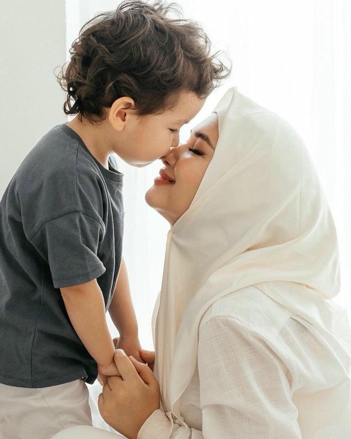 Son kissing mom sweet photo boy kissing mother in hijab forehead