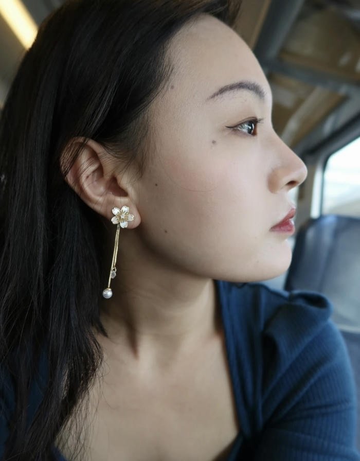 soft beauty flows through girl earrings dp