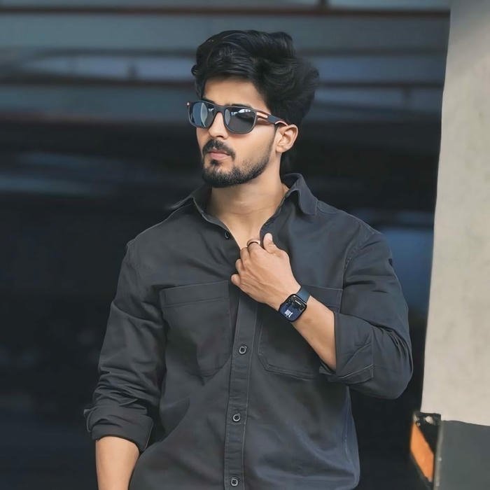 Casual handsome boy black shirt looking away pose