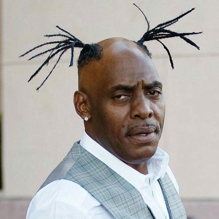 Crazy man with spiked hair looking confused funny meme