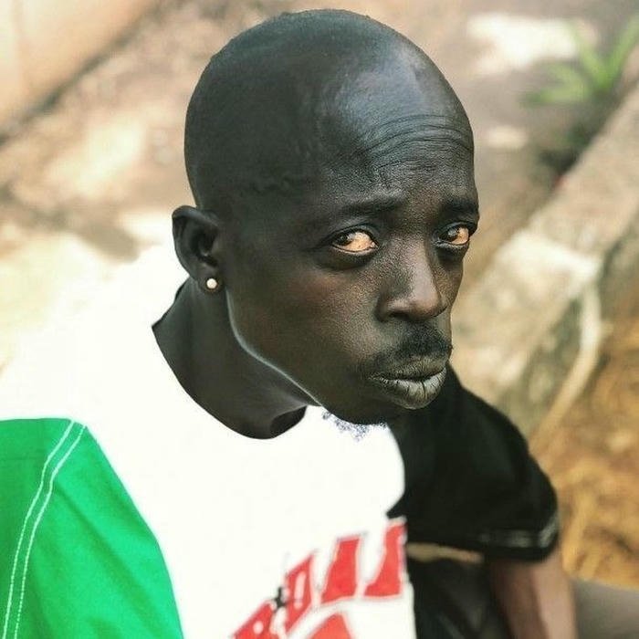 Funny dp for boys dark skin man looking aside serious