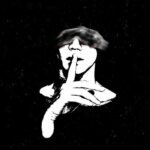 High contrast white silhouette man shushing dark background