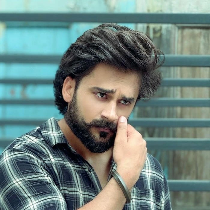 Punjabi boy dp bearded man touching hair looking away