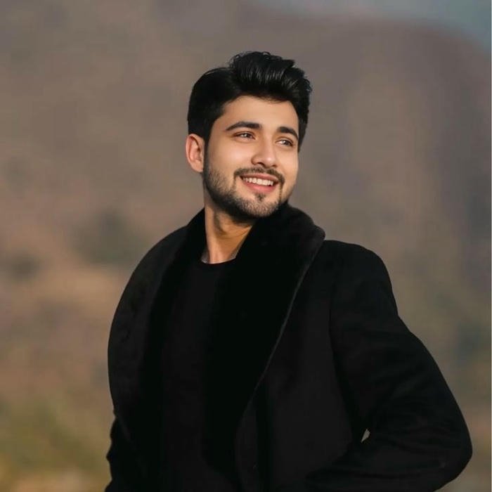 Punjabi boy dp cool guy in black coat outdoor pose