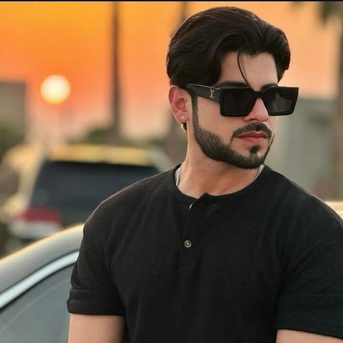 Punjabi boy dp man with sunglasses posing at sunset