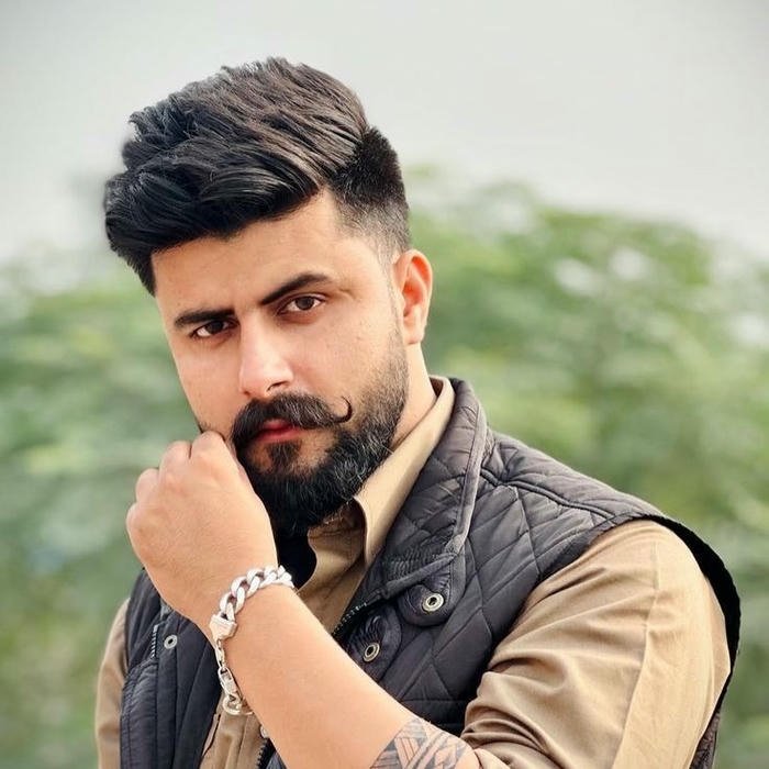 Punjabi boy dp serious bearded man looking at camera outdoors