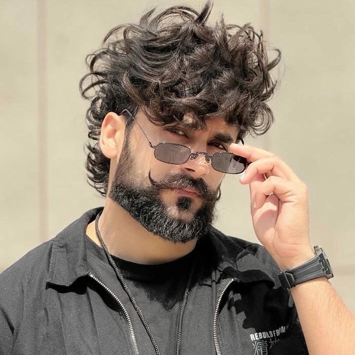 Punjabi boy dp stylish man adjusting sunglasses with curly hair