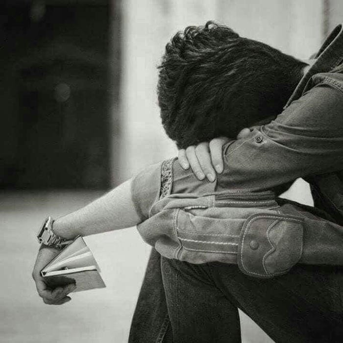 Sad boy dp hd person burying face in arms sitting