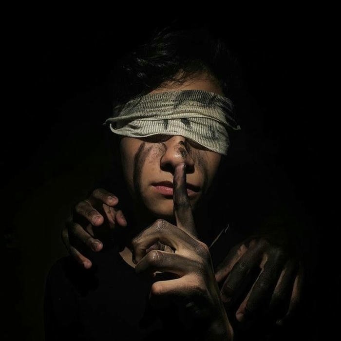 Silent boy dp mysterious man in hat finger on lips