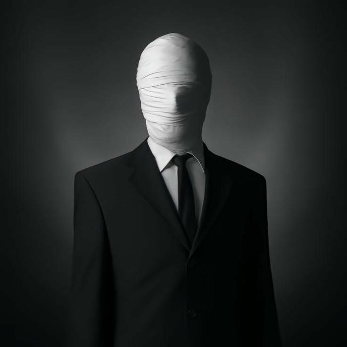 Silent boy dp tall faceless figure suit dark background