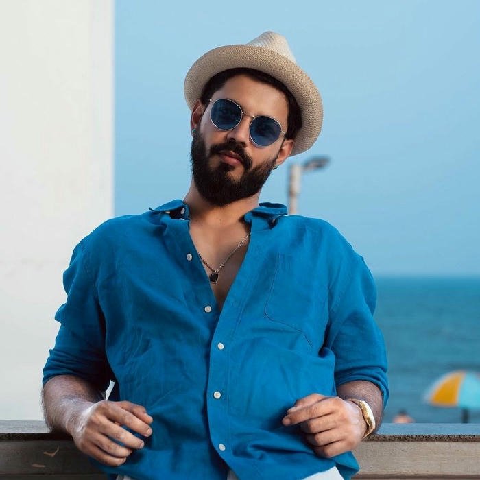 Smart boy dp man with hat and sunglasses beach
