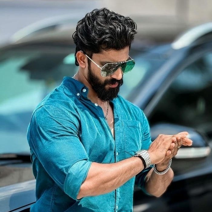 Smart boy dp muscular man in blue shirt outdoors