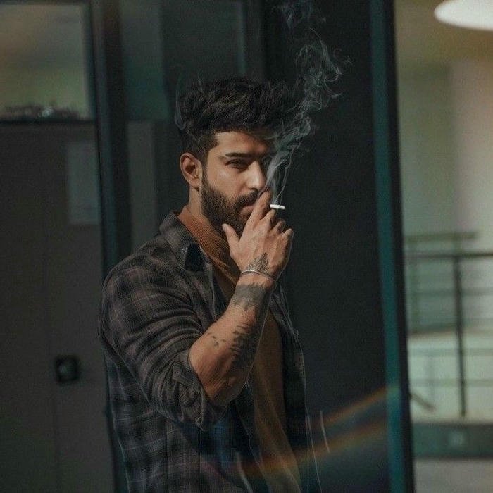 Smoker boy dp casual man in checkered shirt smoking indoors