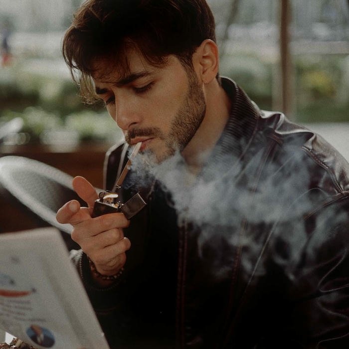 Smoker boy dp man lighting cigarette with reflection in mirror