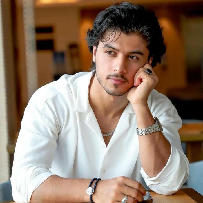 Stylish boy dp download man sitting at table white shirt