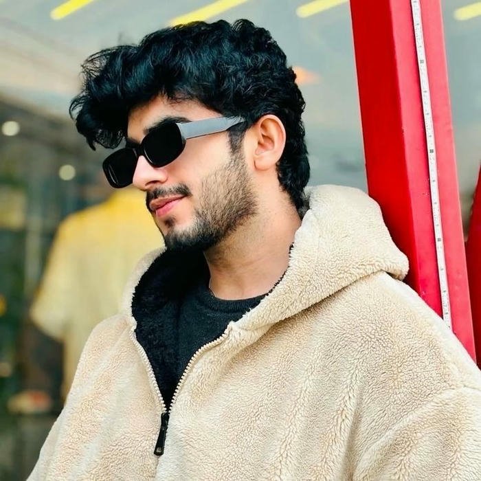 Trendy man beige jacket sunglasses looking side cool