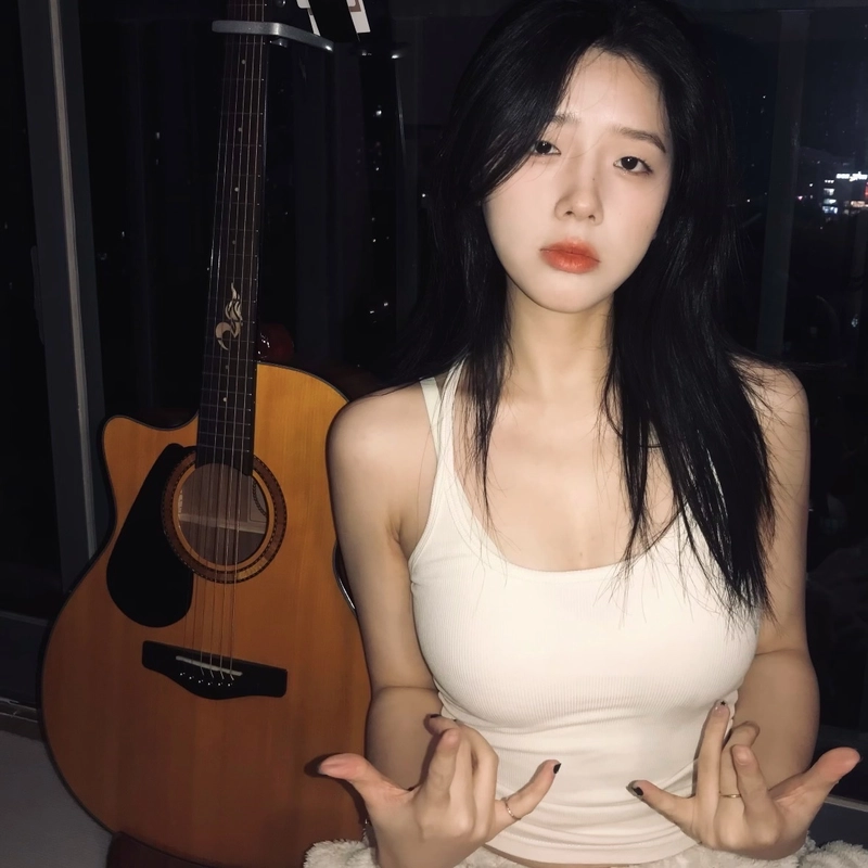 Aesthetic girl with guitar dp with a thoughtful expression