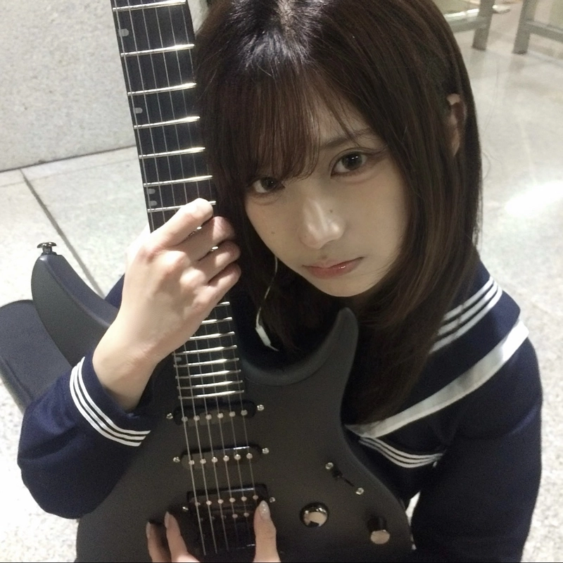 Girl with guitar dp capturing a peaceful moment