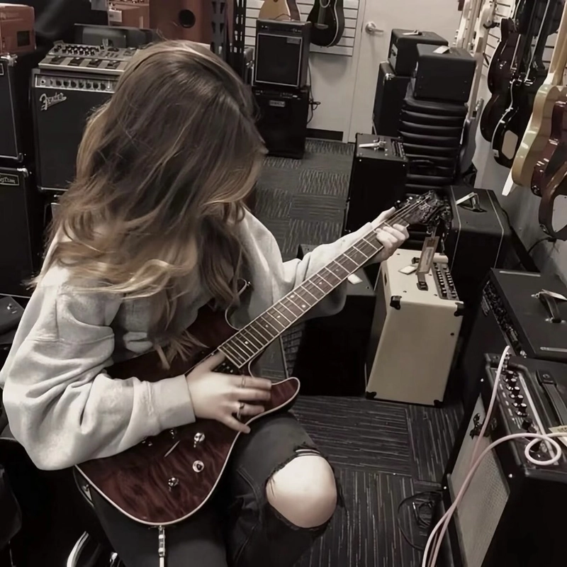 Girl with guitar dp featuring a calm artistic mood