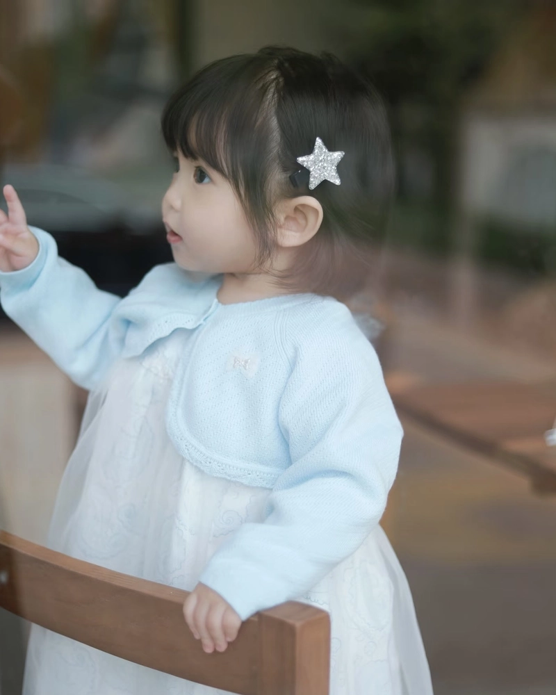 Sweet baby girl picture with gentle lighting aesthetic vibes