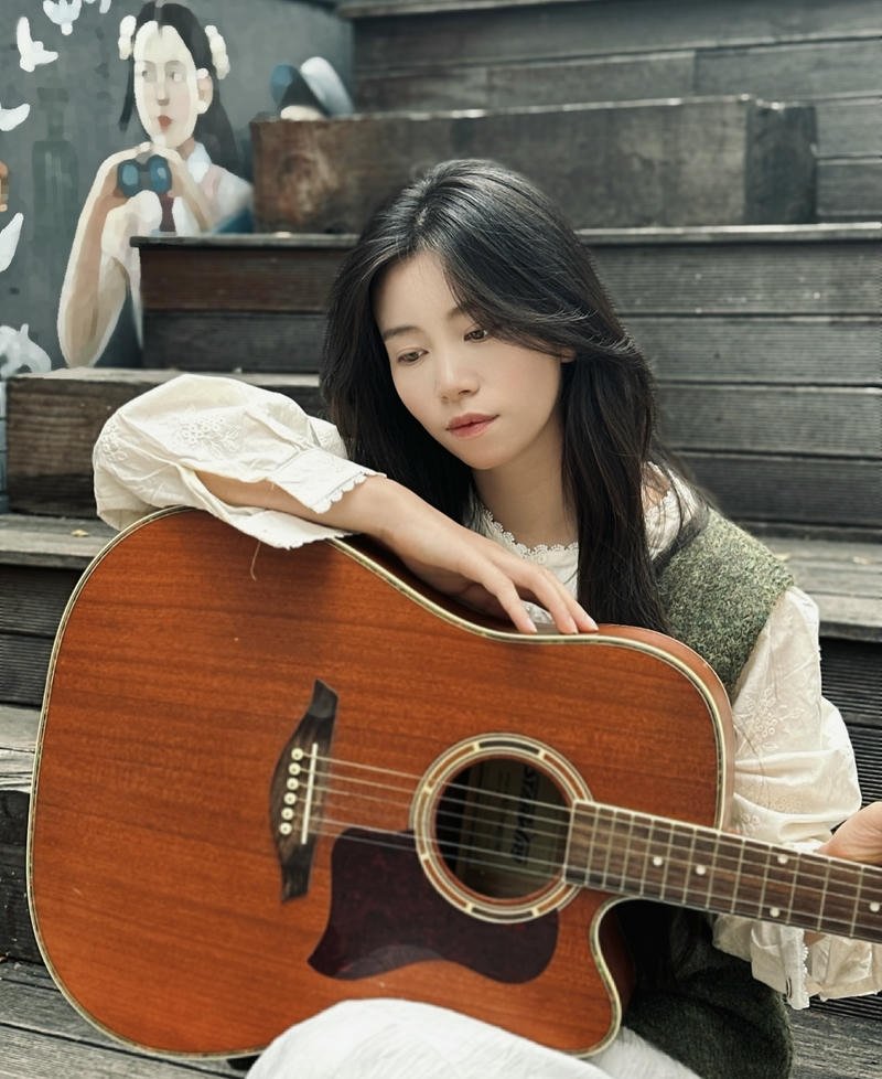 Window light girl with guitar dp gentle warm glow_