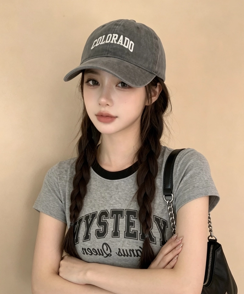 Confident pose with bold streetwear energy cap girl dp image