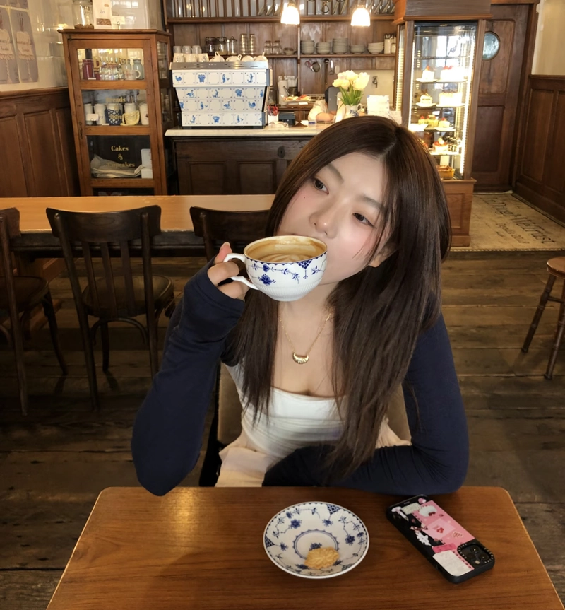 Dreamy urban cafe scene with calm mood cute girl with coffee cup dp
