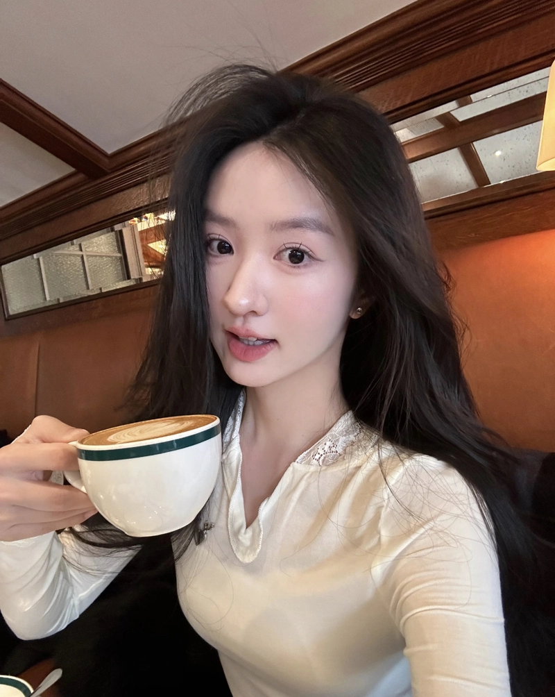 Soft cafe lighting with cozy vibe cute girl with coffee cup dp